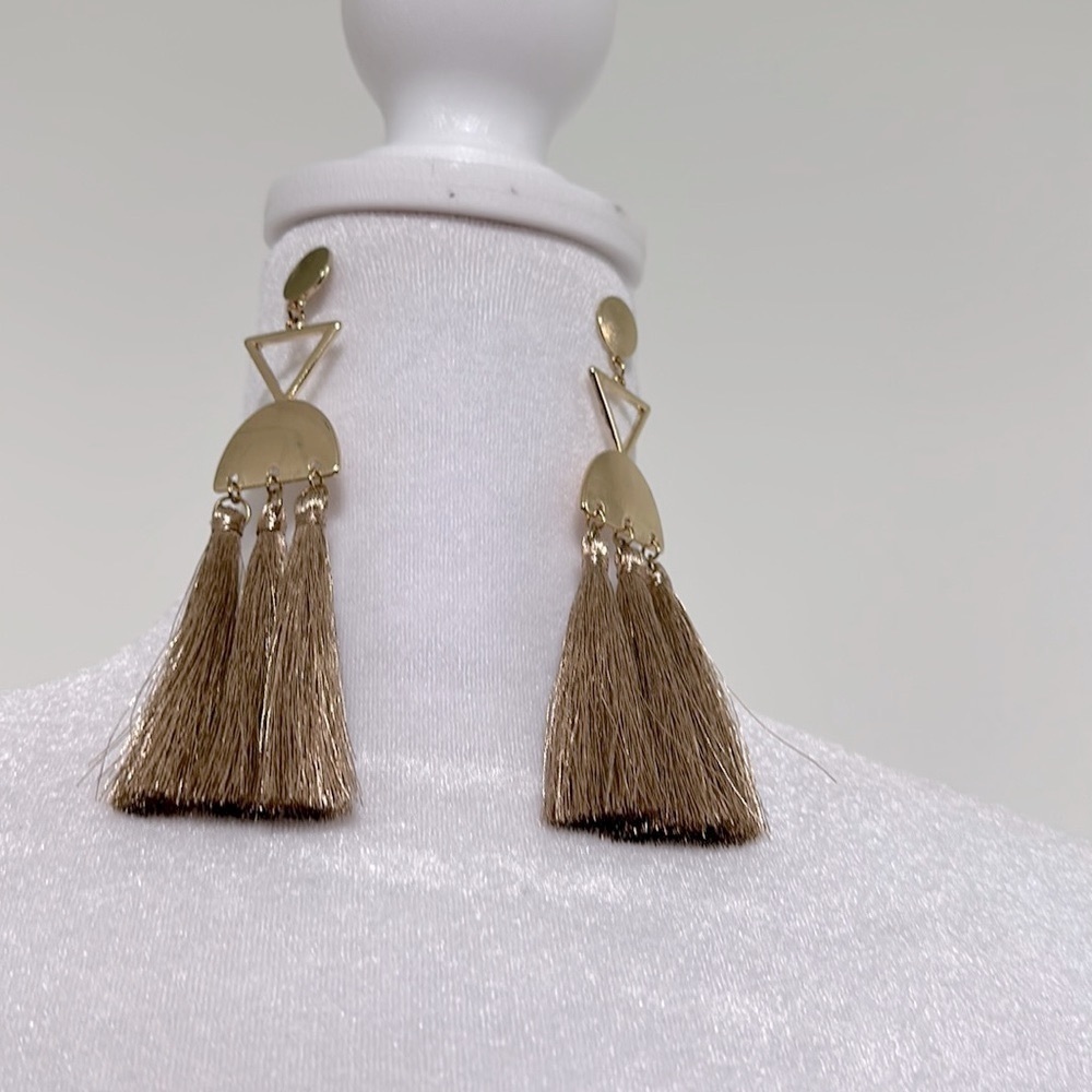 Gold tone chandelier pierced earrings.